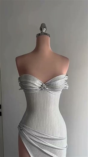 Share with a friend who would own the spotlight in this silver pleated gown! To order, send us a DM