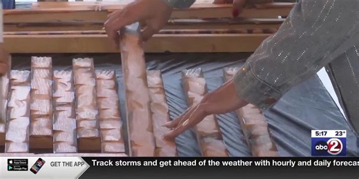 Representatives from all 32 NFL teams build wooden American flags for veterans at Lambeau Field