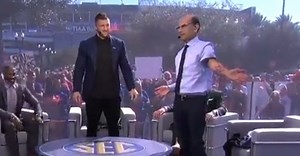 Paul Finebaum shows off Tim Tebow tattoo