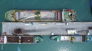 Loading a ship with containers at the port. Sea cargo transportation. Cargo