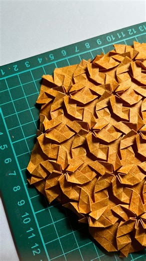 Angeline Cuvertino on Instagram: "Origami tessellation “Caribbean Twist”. After seeing this design on the profile of its creator, Nirmit Zaveri, I couldn’t resist folding it. The way the twists connect is stunning, and the reverse side of the tessellation is equally impressive. Folded with 110 gsm Elephant Hide paper. . . . . . . . #origami #origamitessellation #tessellation #art #fridayfolding @origamiusa"
