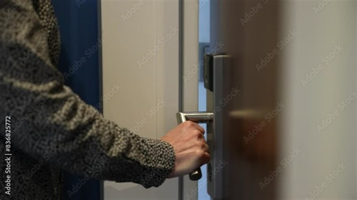 Girl opens door to room with an electronic key. Secure key card system in the hotel. Vacation at the hotel. Safe lock modern technology. Electronic access to office. Business office secure entrance