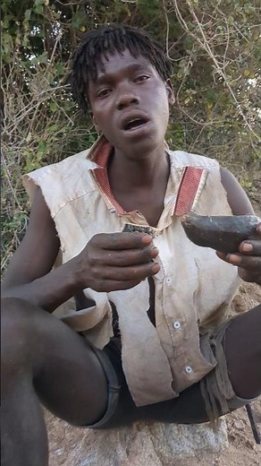 explain using a unique language called "click languages on how to eat#hadzabetribe #bushlife #africa