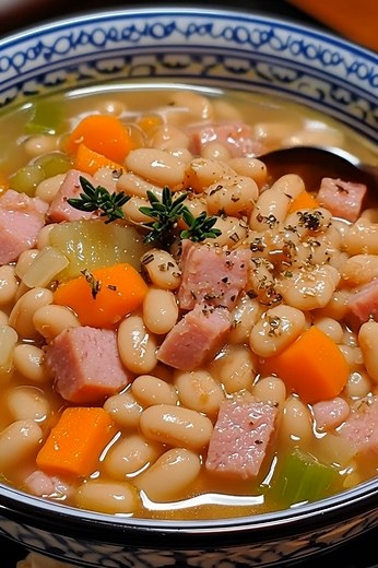 🫘 Classic Navy Bean Soup Prep Time: 15 min Cook Time: 2 hrs (or 6–8 hrs in slow cooker) Total Time: ~2 hrs 15 min Servings: 6–8 Ingredients: 1 lb dried navy beans (rinsed and soaked overnight or quick-soaked) 1 tbsp olive oil 1 medium onion, chopped 2 carrots, diced 2 celery stalks, diced 2 cloves garlic, minced 1 smoked ham hock or 1½ cups diced ham Recipe in First Coʍmеոτ 💬👇 | My Heavenly Recipes