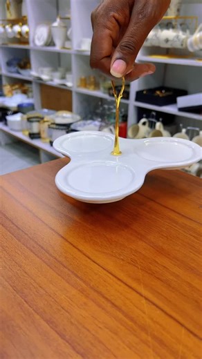 Elegant Three-Tiered Ceramic Tea Set Showcase