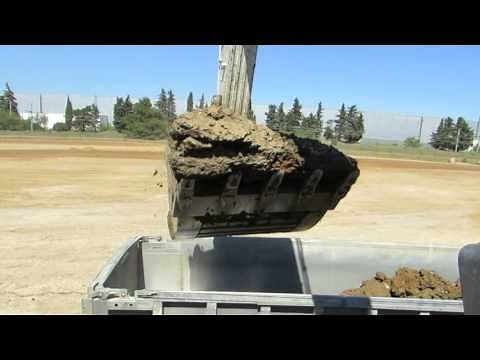 Volvo EC480E loading trucks - Cab view