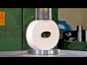 Crushing giant paper roll with hydraulic press