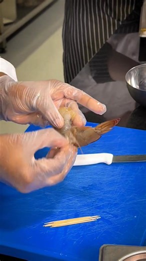 🦐 Chef Tip: How to Devein Shrimp Like a Pro! 🦐 Chef Toyo shows a quick and precise way to devein shrimp using just a toothpick — no mess, no fuss, and perfectly clean results every time! 👨‍🍳✨ Mastering small techniques like this can make a big difference in your culinary skills and presentation. It’s all about attention to detail! #ICCAAbuDhabi #CulinaryTips #ShrimpPrep #SeafoodSkills #LearnWithChefs #CulinaryExcellence #WorldClassCulinary #PassionToProfession #ICCAin90Days #ICCAOnNikon | IC