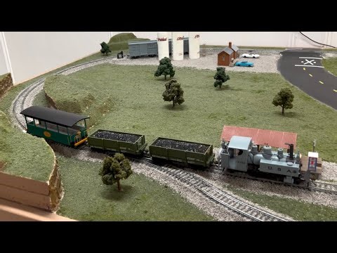 Bachmann On30 Trench engine leads a mixed freight on the layout