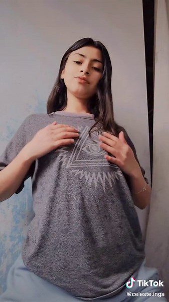 Eye-Catching Hand Movements in Stylish Gray T-Shirt