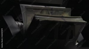 Bill Counting Machine. Money counting equipment with one hundred usd dollar bills. Shadow economy, tax evasion concept. Zoom out 4K shot