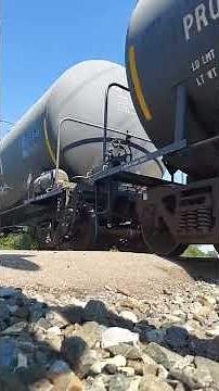 Big CSX garbage train goes past the railroad crossing part 4.