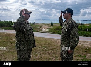 OKINAWA, Japan (Jan. 17, 2023) Yeoman 2nd Class Keegan Randles, left, from Santa Rosa, Calif., assigned to the amphibious transport dock ship USS Green Bay (LPD 20), and Lt. J.g. Joshua McAlister, from Winston-Salem, N.C., also assigned to Green Bay, participate in a reenlistment ceremony on White Beach Naval Facility during landing craft air cushion (LCAC) operations. Green Bay, part of Expeditionary Strike Group 7, along with the 31st Marine Expeditionary Unit (ME), is operating in the U.S. 7t