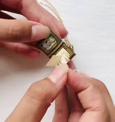 7.7K views · 34 reactions | Here's a thoughtful gift with added WOW factor! Give us a like if you agree 李✨ This super cute and perfectly detailed personalised book locket would make a gorgeous gift for someone special or a treat for yourself. Crafted in brass and made to order by silkpursesowsear.etsy.com, inside is a secret hidden message, fitted to look just like the pages of a real book. The addition of two photos makes this locket even more special and unique.  | Etsy | Facebook