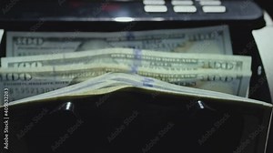 Money counting equipment for paper money calculation. Automatic mechanism for bank financial operations. Currency exchange of one hundred usd. Closeup currency counting machine, slow motion Stock Video