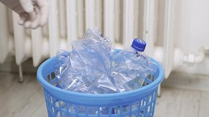 Recycling Plastic Waste, Collecting and Reusing Plastic Garbage, Environment Protection Concept. Used and Empty Plastic Bottles Collected in a Trash Can.