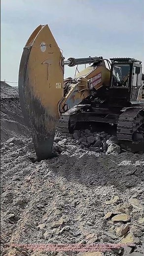 Excavator With Eagle-Beak Rock Bucket Breaking Weathered Rock