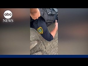 Video shows officer rescued during shootout