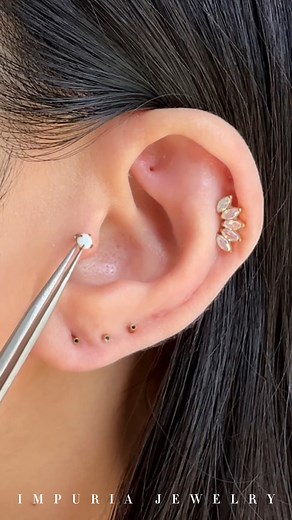 Building a butterfly-inspired ear stack that’s about to flutter into everyone’s feed.🦋 . . . . . . #earpiercings #earrings #piercings #earringsofinstagram #earringstyle #curatedear #earringshop #earringaddict #earringswag #earringstagram #cartilagepiercing #traguspiercing #helixpiercing #jewelry #piercinggirl #daithpiercing #conchpiercing #rookpiercing #earcuration #cartilagepiercings #earstack #earstyle #earstylist #newpiercing #earpiercing #flatpiercing #snugpiercing #lobepiercing #forwardhel