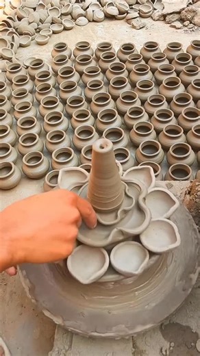Authindia - Indian Handicrafts on Instagram: "There’s something magical about watching a simple clay diya transform under an artist’s hands. Check out the delicate process of carving cutout patterns into a pottery diya — every curve, dot, and opening shaped with patience and precision. These handcrafted designs don’t just make the diya beautiful; they let the light dance through the patterns, creating those soft festive shadows we all love. It’s a small craft with a big heartbeat, keeping our po