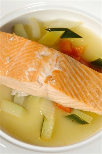 Poached king salmon with court bouillon and crisp garnish
