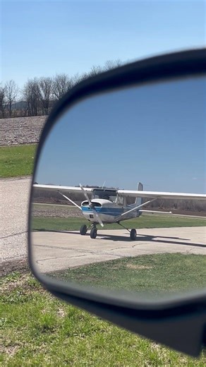 Cessna 150 in the mirror