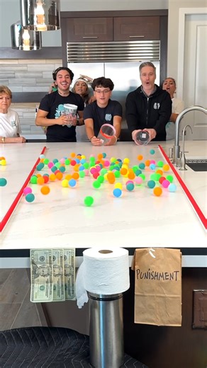 "Roll it, Sink it, Win it 🧻 PART 2 Our family rolls buckets full of ping pong balls to try to land one in the center of the toilet paper roll. Boys vs. girls #challenges #fblifestyle #familygames #teamfamily" 🎬 This video was produced by Network Media and The Tus House | Challenge Accepted