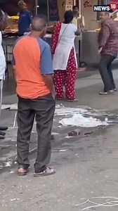 A video of a couple involved in a heated scuffle on the streets has gone viral online. Watch here👇 #viralvideo #couples #couplefight #argument #funny #bizarre | News18