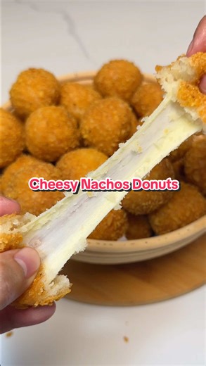 Cheese Nachos Donuts | No-Knead, No-Bake #recipe⤵️ ✔️Dough 1 whole egg (large) 3 tbsp sugar (38g) 2 tsp instant dry yeast (6g) 1/3 cup veg. oil (80ml) 1 cup fresh milk (240ml) 3 cups all purpose flour (405g) 1/4 cup crushed nachos (30g) 1/2 tsp salt (3g) ✔️Coating / Filling 2 whole eggs (large) 1 & 3/4 cups crushed nachos (200g) *mozarella cheese (or any preferred type of cheese) Procedure: 1. In a mixing bowl, combine the egg, sugar, instant yeast, oil and milk. Stir until sugar dissolves. Add-