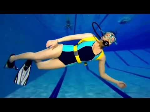 Female Diver is Diving with Swim Suit and Rubber Swim Cap