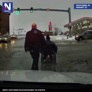 14K views · 790 reactions | OFFICER TO THE RESCUE: A police officer in South Bend, Indiana, hurried to help a man in a wheelchair safely cross a busy intersection in bad weather. | NEWSMAX | Facebook