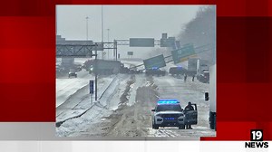 Overhead sign falls across I-77 after dump truck crash