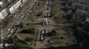 CHISINAU, MOLDOVA - Aerial drone view flight over the Buildings streets and Afghan park . Beautiful warm winter day in Kishinev, Riscani district