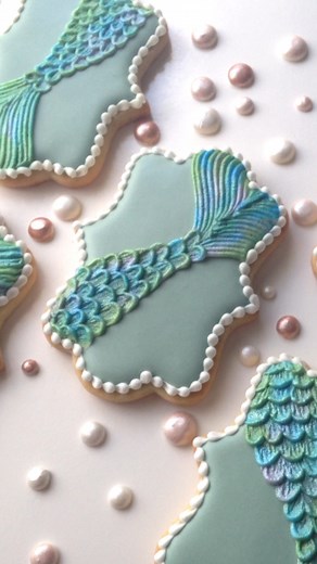 These mermaid tail cookies are one of my favorite designs ever! I made the pale sage green with a mixture of blue, yellow, and brown food coloring. | SweetAmbs