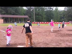Emma (8 yrs old) playing softball