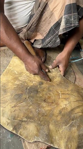 Perfect leather cutting technique by a skilled worker. So satisfying to watch!
