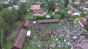 Swedish Midsummer dance around the pole drone view from above. Gathering to celebrate in a traditional Swedish way. Captured from a unique bird's eye perspective in Stockholm