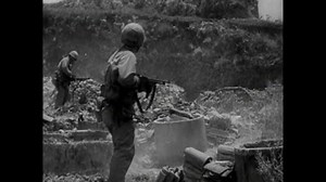 CIRCA 1945 - Soldiers raise American flag on Iwo Jima as Japan surrenders in World War Two.
