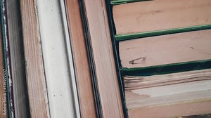 Bookshelf with old shabby books. Concept on the theme of history, nostalgia, old age.