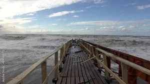 Cyclone, massive storm. Wind 27 m per sec, consequences 7-8 points of storm, wave height 4-5 meters, flood havoc. Destruction on waterfront of resort town, ruined pier. Dead swell persists