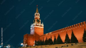 Kremlin Chimes or Kremlin Clock with red star on it and Saint Basil's Cathedral and Lenin mausoleum in Red Square, Moscow, symbols of the country, night, winter, blue sky, panorama