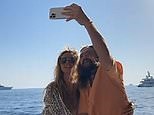 Heidi Klum strikes a pose in a wrap dress while enjoying Capri boat vacation
