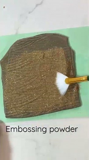 Polymer Clay: adding embossing powder to clay.