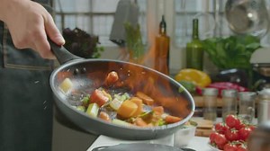 Chef Cooking Flambe Vegetables