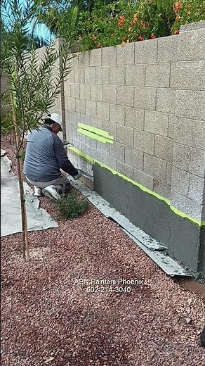 Cinder block wall repair and painting.
