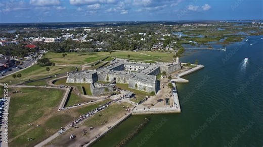 Castillo de San Marcos, the oldest masonry fort in the continental United States, stands prominently on the Matanzas River waterfront in St Augustine Florida, surrounded by parkland and urban areas.