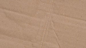 Download Stop motion animation texture of cardboard or brown paper. abstract texture as background for free
