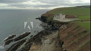 Aerial view moving across the headland heading from Dunbeath towards Dunbeath Castle, Caithness, Scotland
