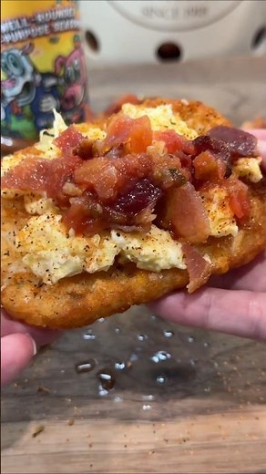 Air fryer hash browns with eggs, bacon, cheese, and salsa. Easy breakfast idea.