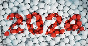 New Year's screensaver 2024 red glossy, formed from moving billiard matte white balls. 3D rendering.